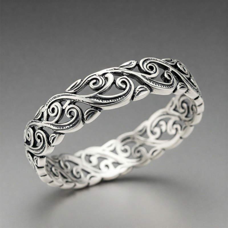Silver bracelet adorned with vine patterns reflecting natural elements
